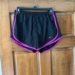 Nike Black and Pink Athletic Shorts with V-Notch Design